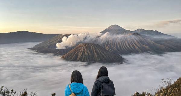 Travellers watching Mount Bromo at sunrise