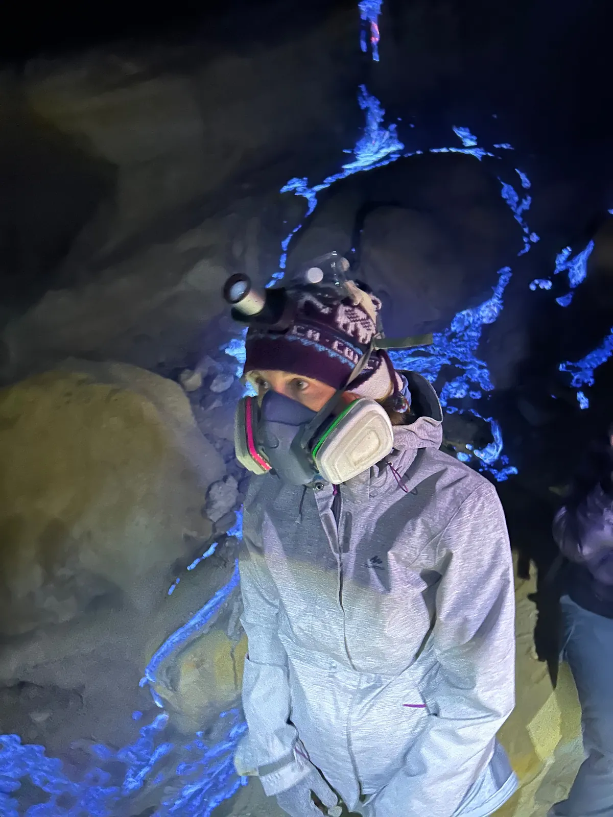 Traveller wearing a safety mask beside the Ijen Blue Fire