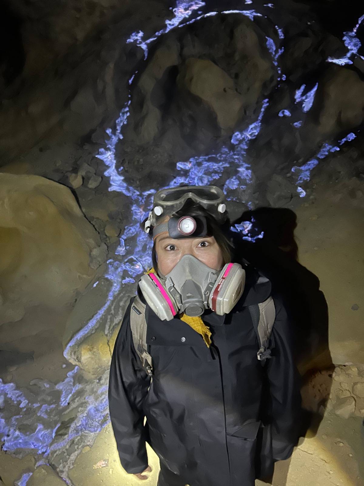 Traveller wearing a safety mask beside the Ijen Blue Fire