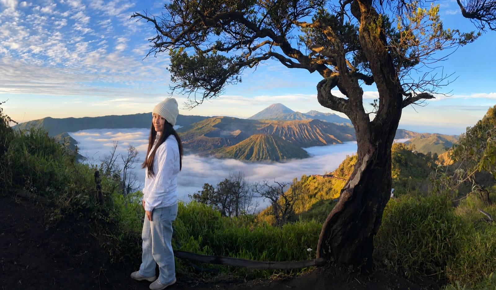 Traveller at the clear Mount Bromo sunrise panorama