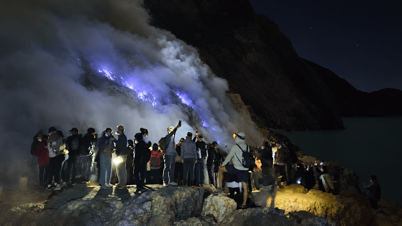 Travellers visiting the Ijen Blue Fire