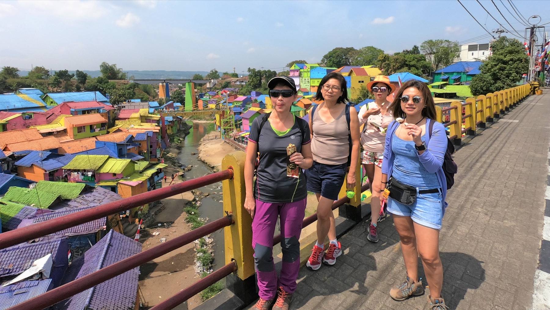 Travellers visiting the colourful Jodipan Village in Malang