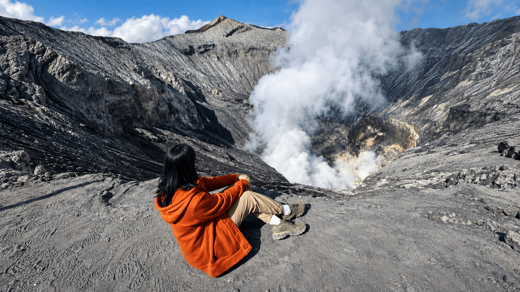 Traveller at the Mount Bromo crater rim