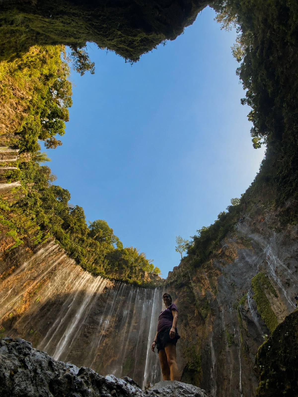 Guest inside the Tumpak Sewu waterfall basin